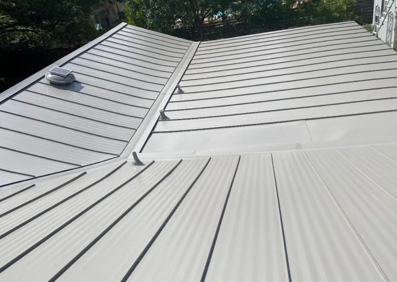 Solar attic fan installed on a metal roof for Roof Ventilation in Lake Murray of Richland